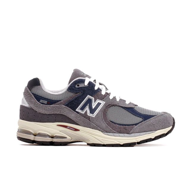 New Balance Unisexe 2002R en Marine avec Castlerock et gris ombre